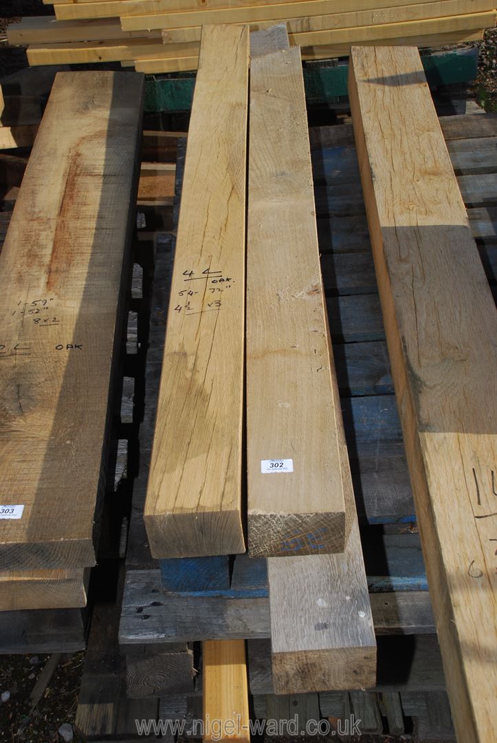 Four lengths of oak 4 1/2" x 3" x 54"-72" long.