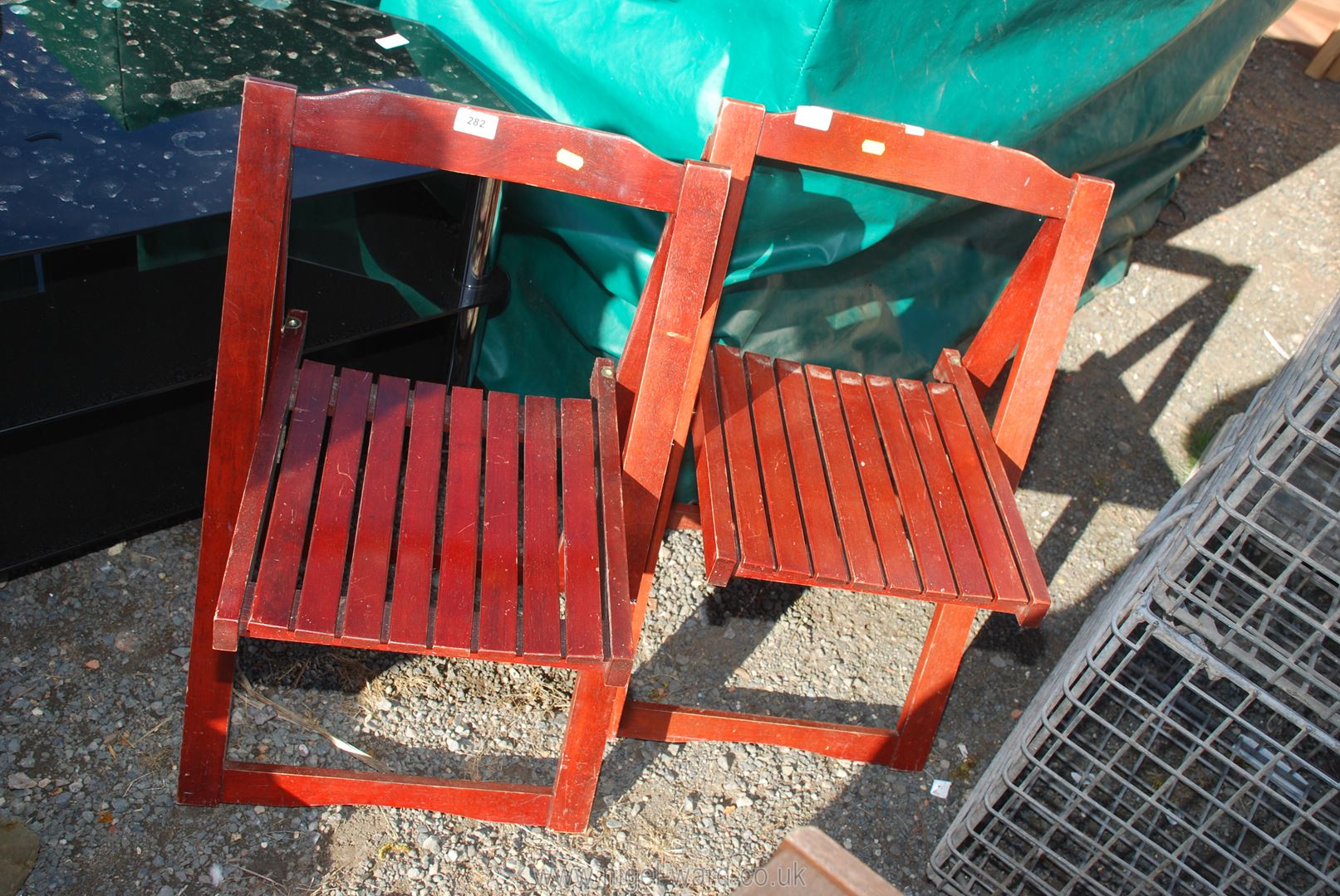 Two wooden folding chairs.