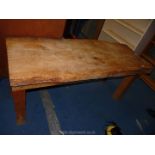 A rustic single plank kitchen table, 69 1/2" long x 28" wide x 30" high.