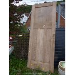 A four panel oak interior door.