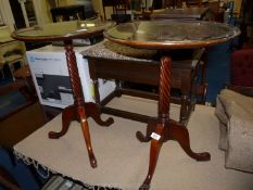 A pair of glass topped occasional tables.