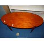 An oval topped Lounge Table, 42'' long x 19 3/4'' wide x 17'' high.