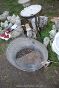 A metal wash stand with enamel basin and large galvanised bath.