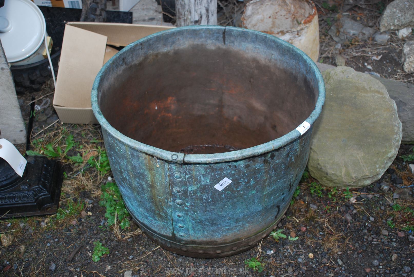 A riveted Copper boiling pot, converted to a planter or useful as a log box,