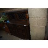 A dark wood glazed sideboard, 4ft wide x 18" deep x 50" high.