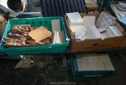 Two boxes of tiles, various sizes and patterns.