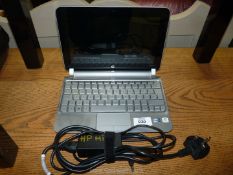 An HP Mini 210-2003sa Netbook laptop computer with charger, Windows 7, Intel Atom Processor,