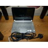 An HP Mini 210-2003sa Netbook laptop computer with charger, Windows 7, Intel Atom Processor,