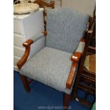 A blue upholstered arm chair.