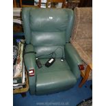 A green faux leather electric recliner.