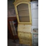 A bureau with glass top shelf, 74" high x 21" wide x 15" deep.