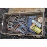 An old box full of tack, curry combs, bits, etc.