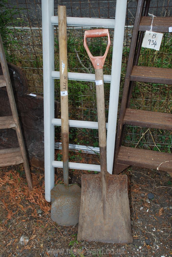 A long handled Shovel with curved bottom and another shovel.