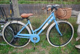 A "Canellini Via Veneto" bicycle with wicker shopping basket.