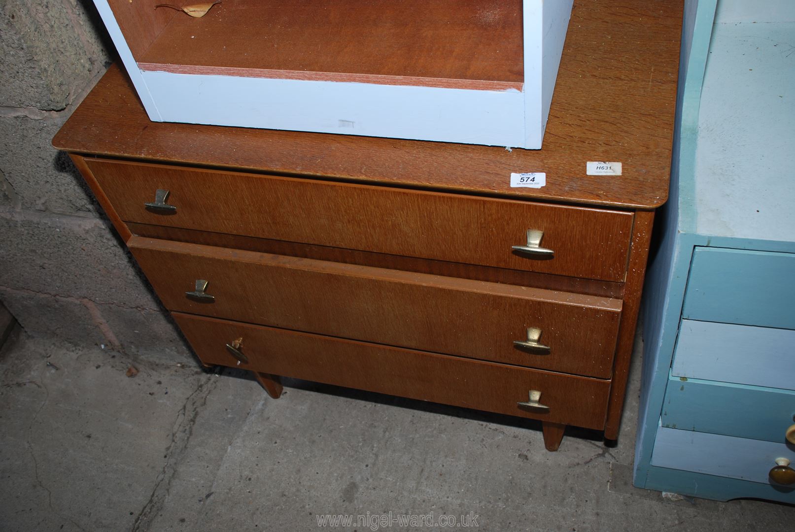 A 3 drawer chest of drawers, 31" wide x 17" deep x 28" high.