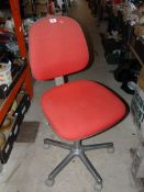 Red swivel office chair.