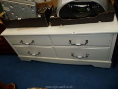 A low white painted side board with 4 drawers, 22 1/2" x 50" x 23 1/2".