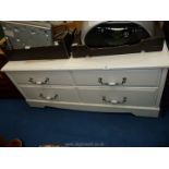 A low white painted side board with 4 drawers, 22 1/2" x 50" x 23 1/2".