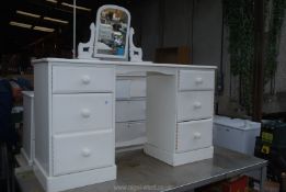 Two dressing tables (one with mirror), bedside table and chest of drawers.