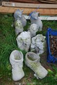 A quantity of garden ornaments to include boots, lions, etc.