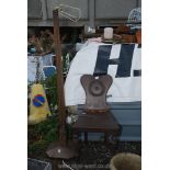 A wooden standard lamp and a hall chair in need of restoration.