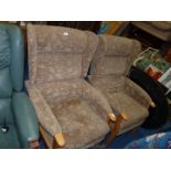A pair of Parker Knowle style lounge chairs.