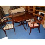 A mahogany dining table with 6 chairs and 2 carvers.