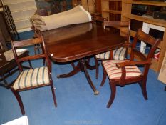 A mahogany dining table with 6 chairs and 2 carvers.