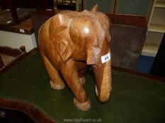 A large carved elephant, 15" tall.