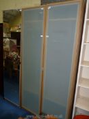 A pair of single wardrobes with frosted glass plastic doors plus a mirror fronted cupboard (a/f),