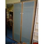 A pair of single wardrobes with frosted glass plastic doors plus a mirror fronted cupboard (a/f),