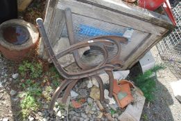 A pair of cast iron bench ends.