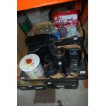 Two boxes of miscellanea to include; Tassimo coffee maker, biscuit tin, icing tubes, vases, etc.