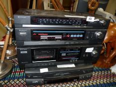 Two Hitachi amplifiers and a Goodmans VHS player.