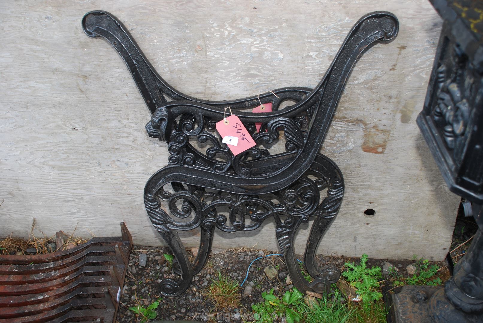 A pair of cast iron bench ends.