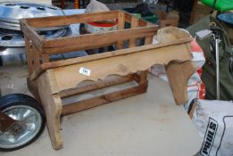 A pine shelf and wooden crate.