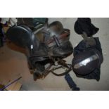 An Ideal saddle, head collar and riding hat, saddle measure 17" .