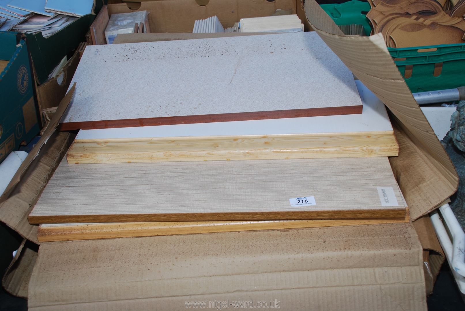 Eight wooden panels, possibly samplers for kitchen cabinets.