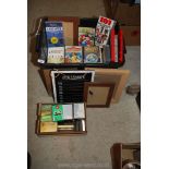 A quantity of videos, cassettes and picture frames.