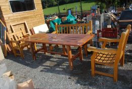 A varnished wood Patio table (90" long x 33" wide x 29" high) with 2 chairs and a bench (5' wide x