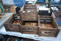 Four apple type crates with rope handles, as new.