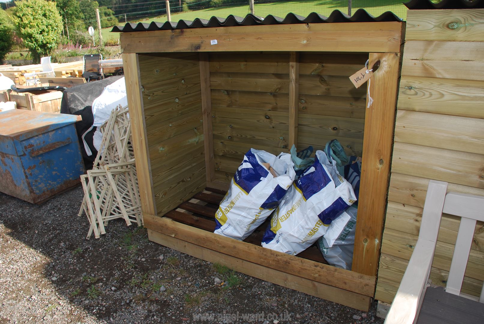 A wooden Wood store, 62" wide x 32" deep x 59" high.