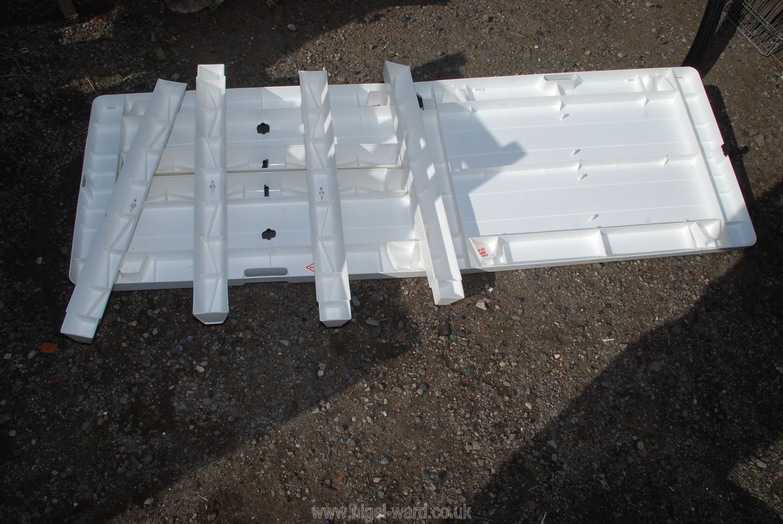 A white folding table 71" x 2'. - Image 2 of 2