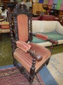 An elegant old Oak framed open armed Elbow Chair having carved and fretworked detail depicting