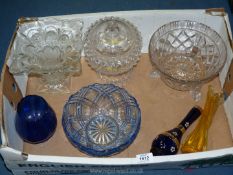 A box of pressed glass bowls, vases, blue bowl, Czech blue and gold bud vase, yellow celery vase.