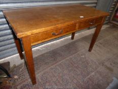 A medium Oak ministry type side Table having two frieze drawers and standing on tapering square