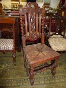 A circa 1900 Oak side Chair having a solid seat,