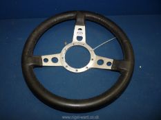 An aluminium and leather rimmed Steering wheel, 14" diameter.