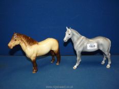 Two Beswick horses including a Highland pony (some crazing) and a solid grey riding pony 7½" tall