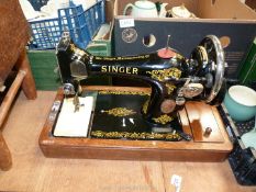 A bentwood cased Singer sewing machine F8447947.